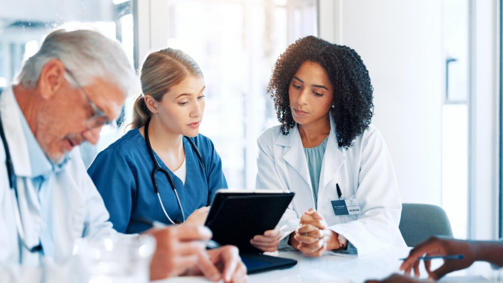 Behavioral health professionals collaborating during a clinical team meeting