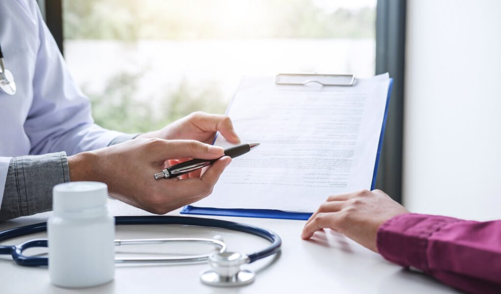 Doctor explaining medication management plan to patient during behavioral health appointment