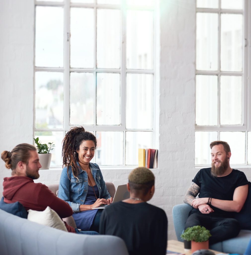 Group therapy circle with engaged participants supporting each other during substance use recovery