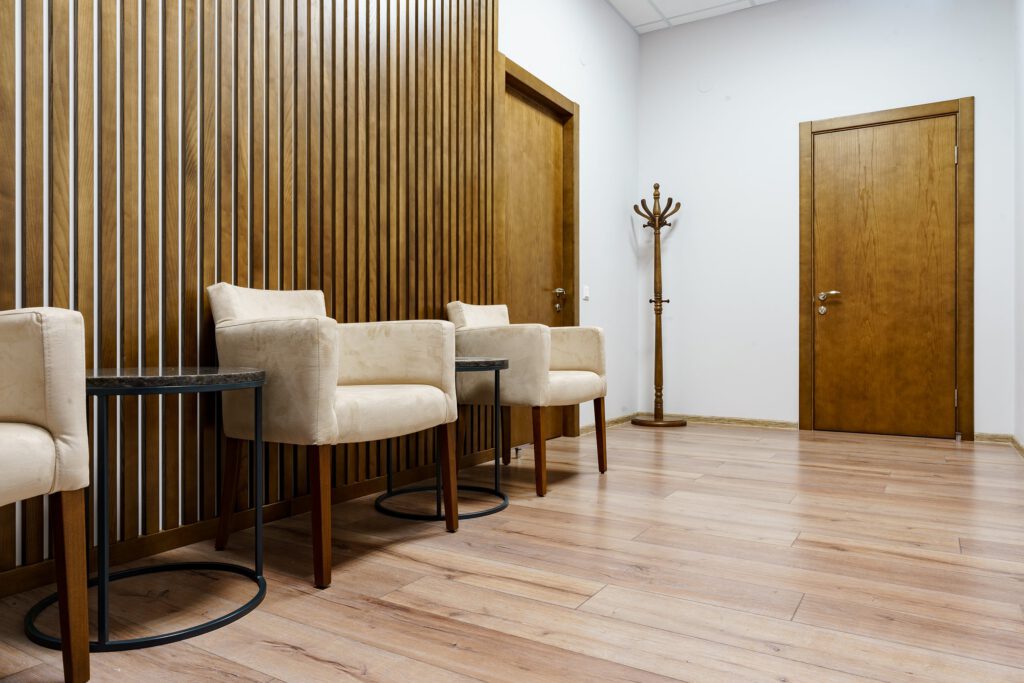Clean and modern outpatient clinic waiting area with comfortable seating for patients