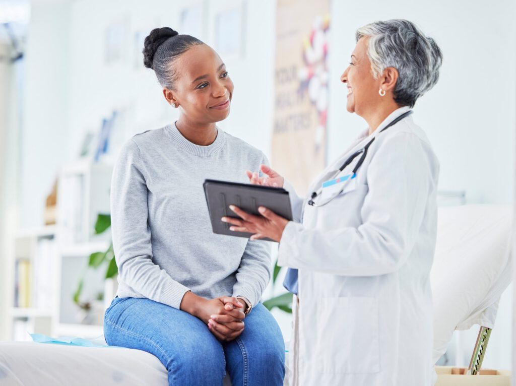 Doctor and patient having a professional consultation with a tablet at an outpatient behavioral health clinic