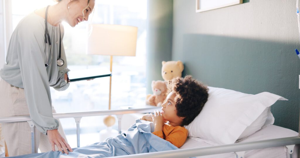 Doctor checking on child during hospital visit
