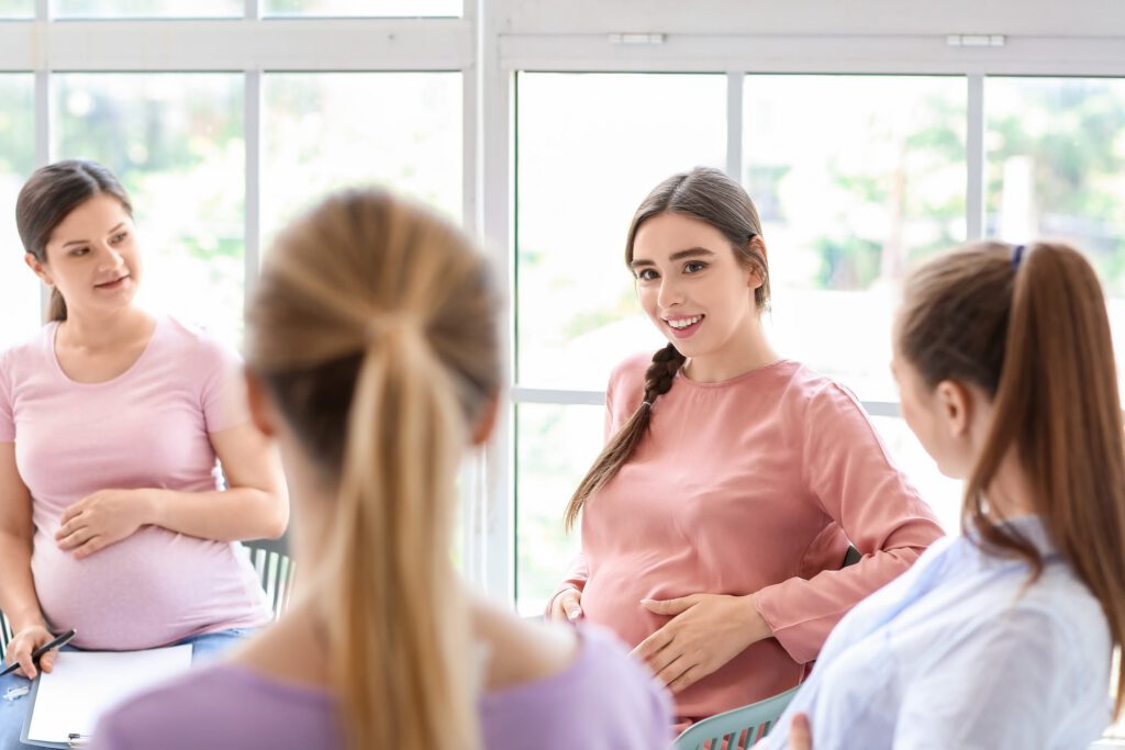 Pregnant women talking in a prenatal support group