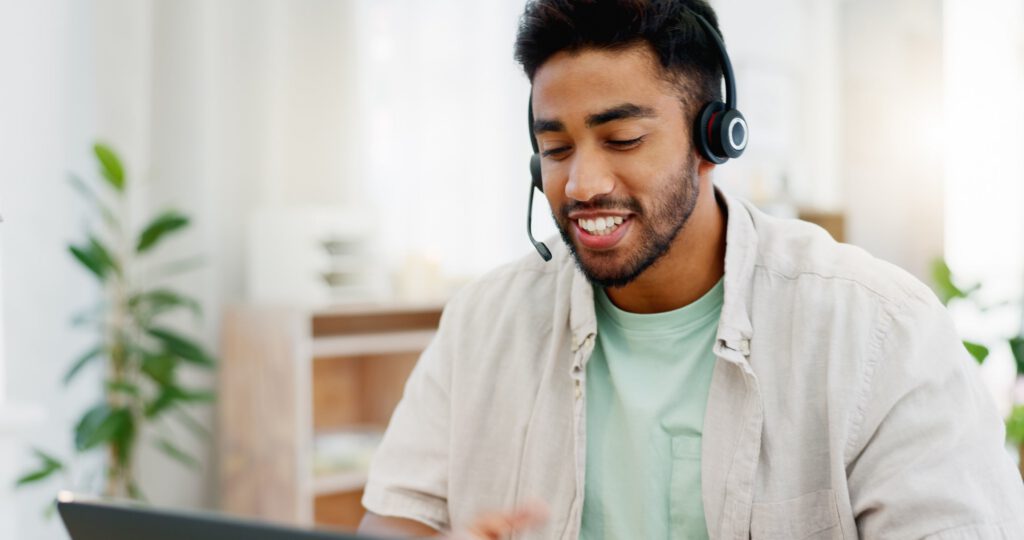 Man wearing headset during video counseling call